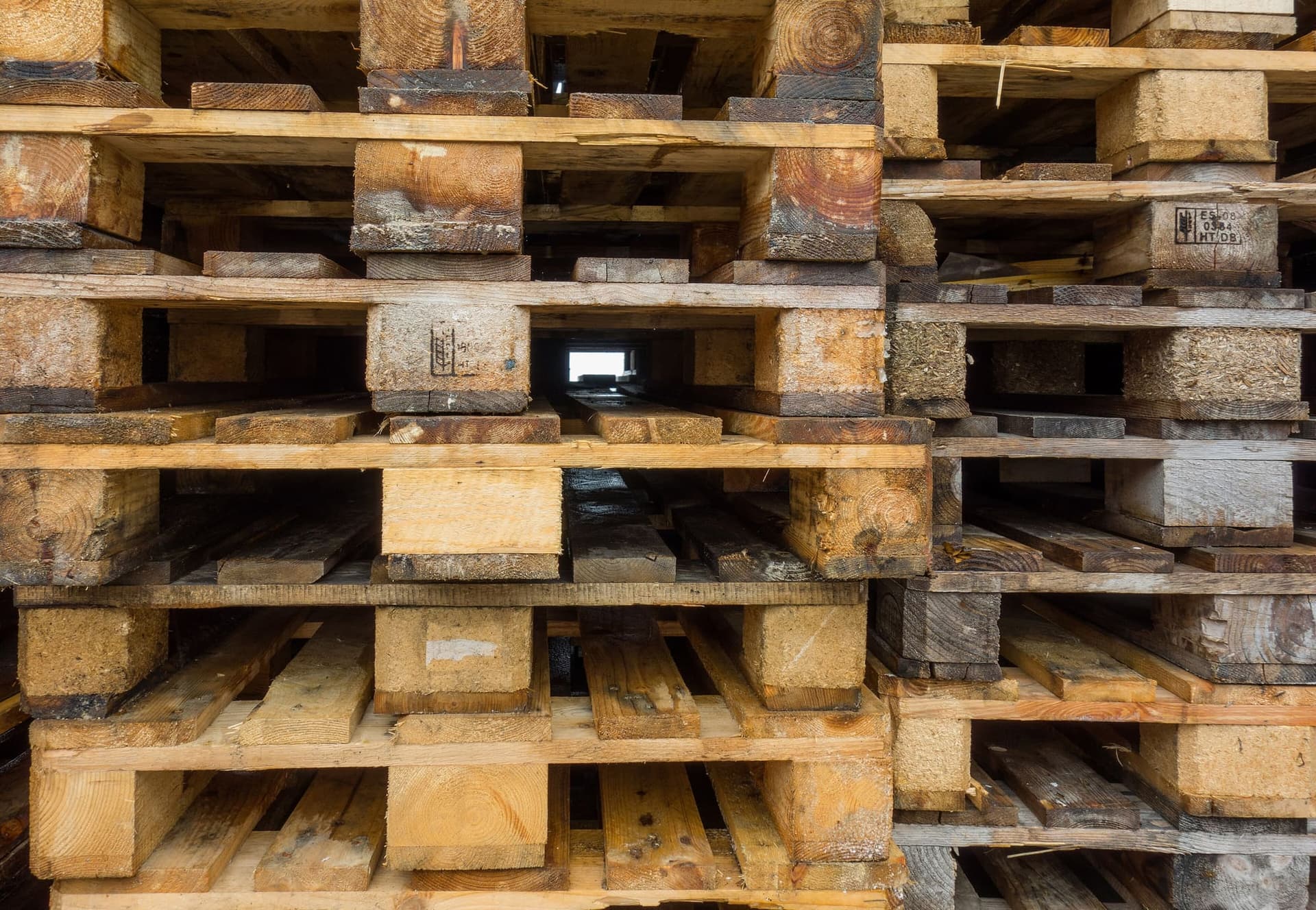 Wooden pallets stacked on top of each other.